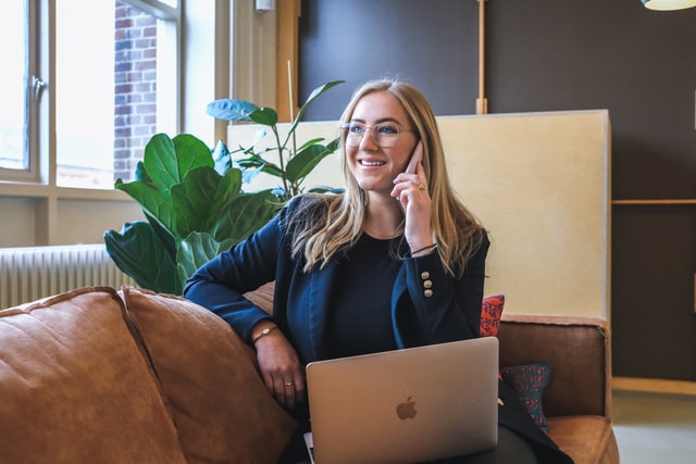 woman on the phone with a laptop