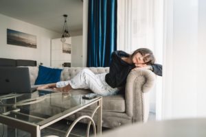 woman lying on a couch