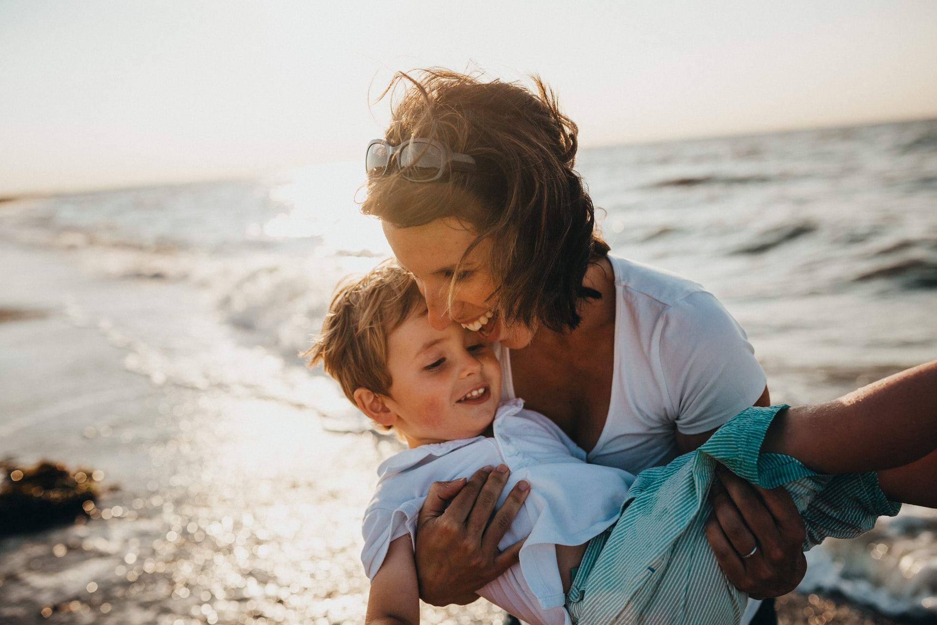 lifestyle photo for quality of life - mom with her son on the beach