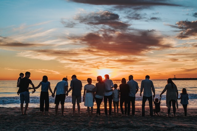 big family at the beach