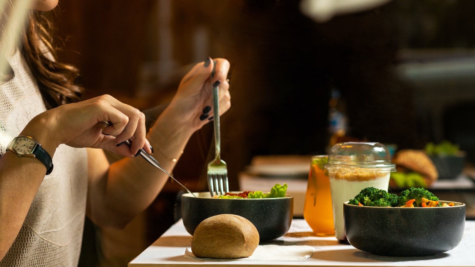 woman eating a salad to get her daily dose of healthy vitamins