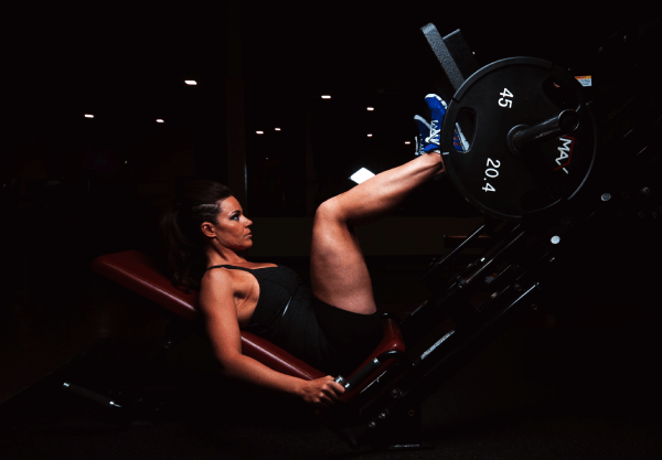 women doing leg presses at the gym