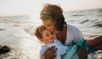 lifestyle photo for quality of life - mom with her son on the beach